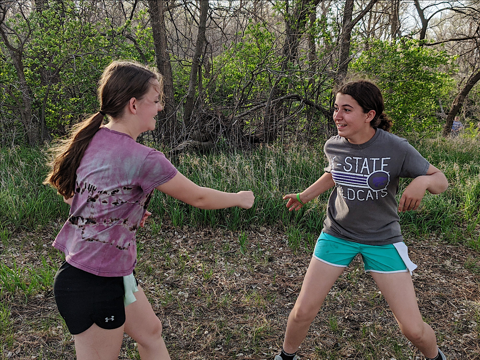 Josie and Maddie facing off during capture the flag! Josie and Maddie facing off during capture the flag!